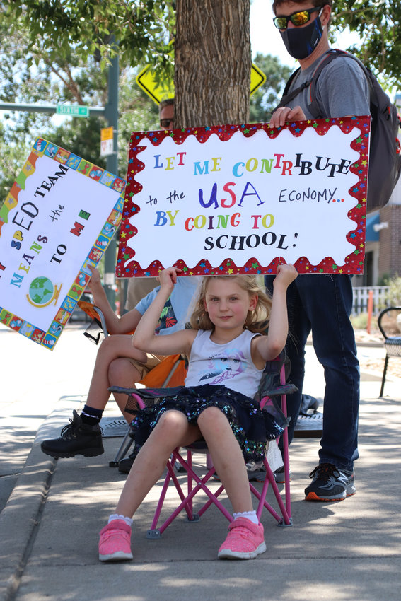 Serene Cline, 9, protests with her parents on July 31, 2020. The Cline family urged Douglas County School District to allow for 100% in-person learning.